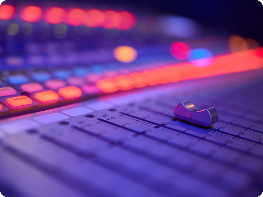 close-up of audio fader and mixer